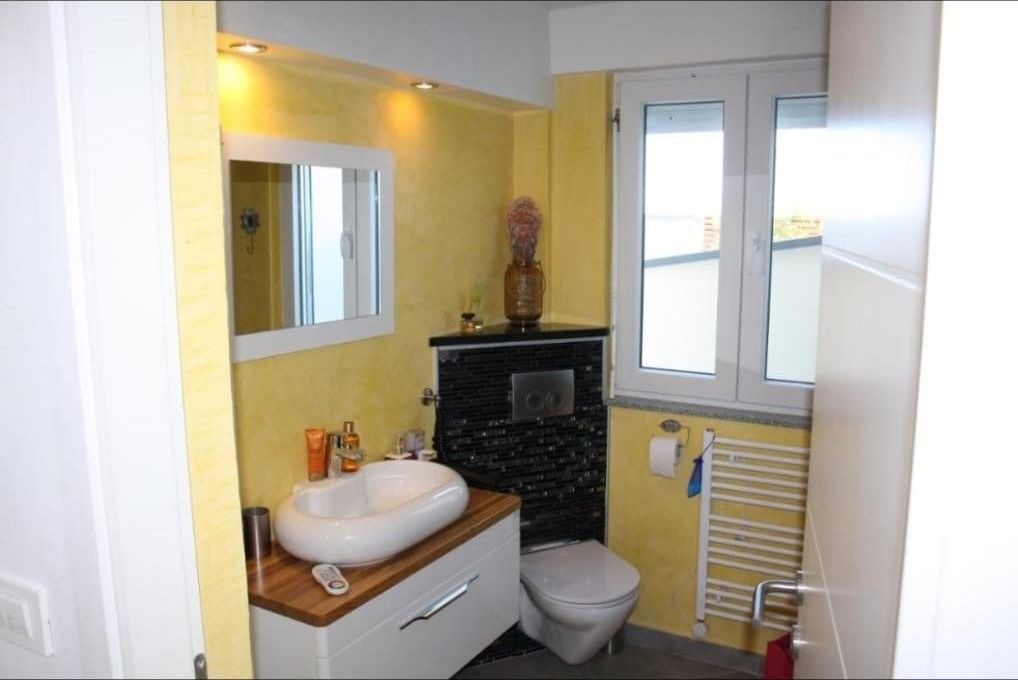Bright bathroom with countertop washbasin