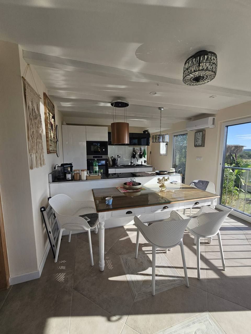 Open-plan kitchen and dining area with plenty of daylight