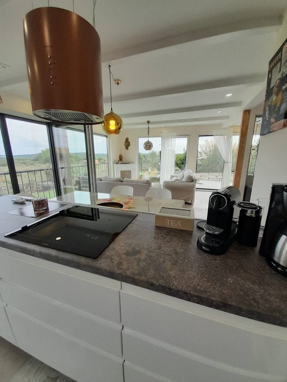 Kitchen with island and induction hob
