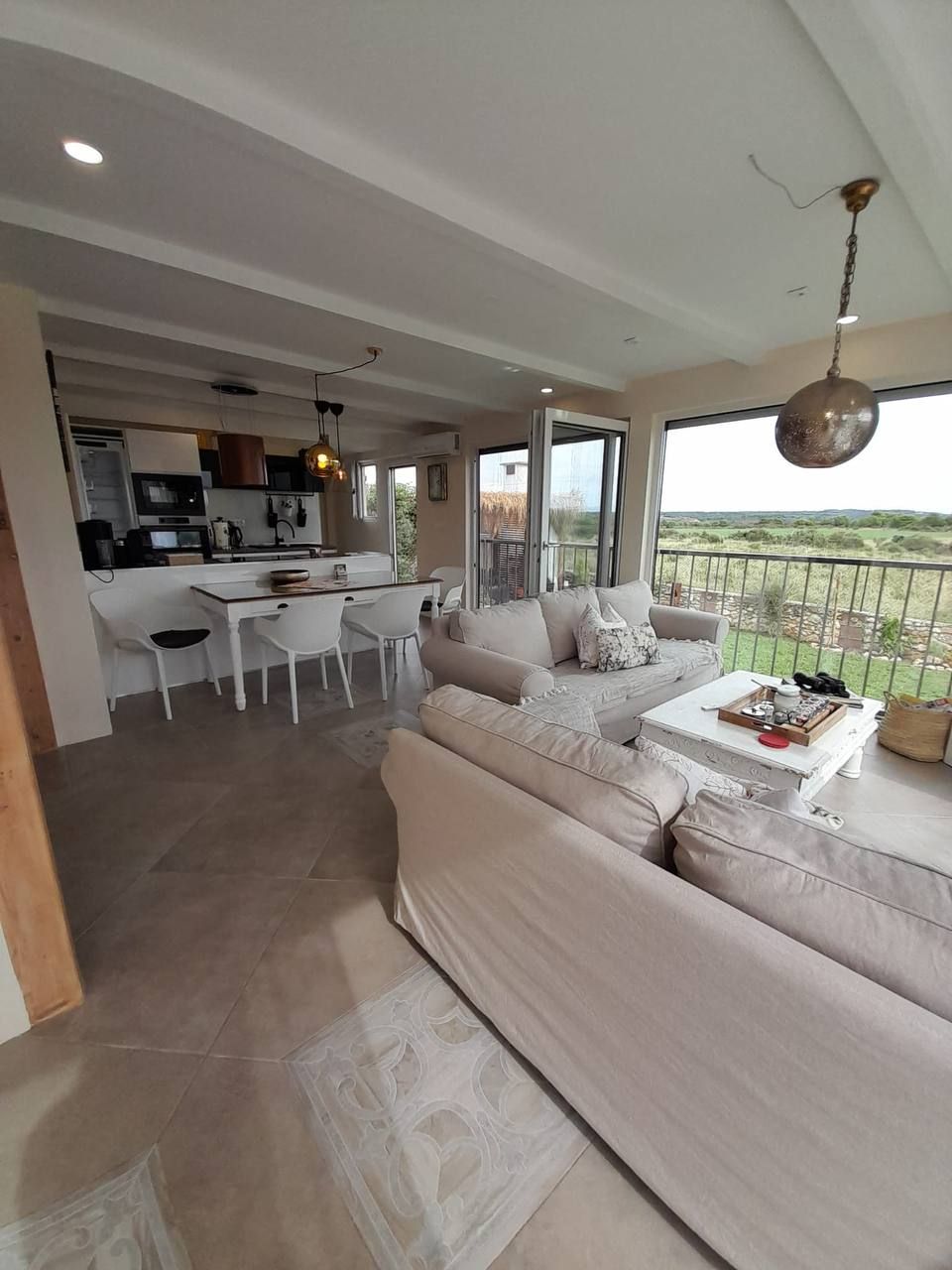 Living and dining area with panoramic windows